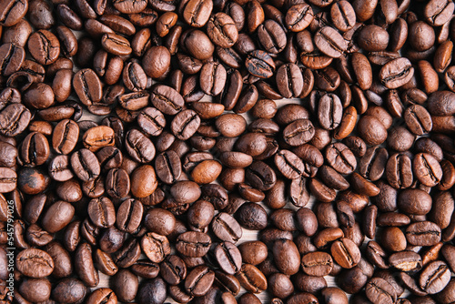 Closeup of brown roasted coffee beans background