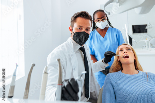 Dentist fixing patients teeth.