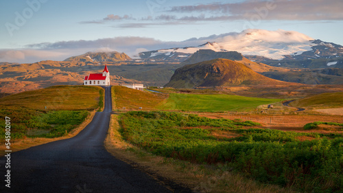 Ingjaldshólskirkja standing in the horizon somewhere on the Snaefellsnes peninsula, Vesturland, Iceland. photo