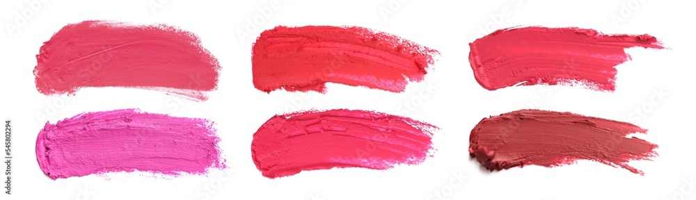 Smears of different beautiful lipsticks on white background, top view. Banner design