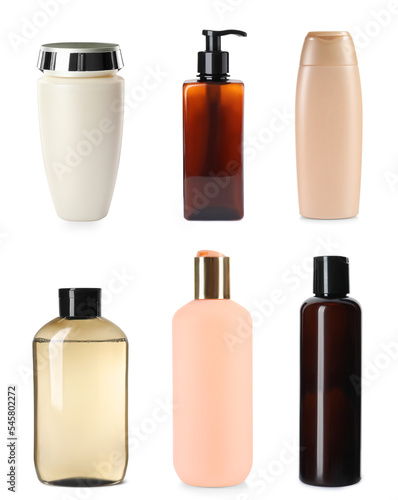 Set with different bottles of shampoo on white background