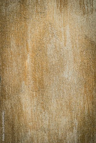 Old rough yellow cement wall surface Artistic. Walls and background, yellow c...
