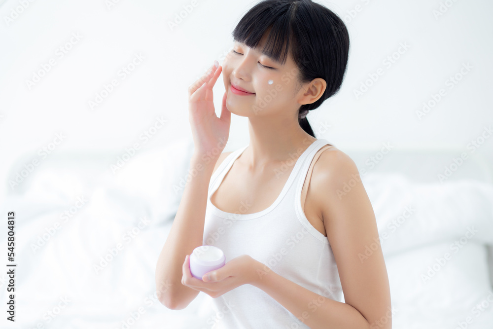 Beautiful young asian woman holding cartridge applying cream or lotion with moisturizer to skin on face, beauty asia girl applying skincare touch facial with cosmetic makeup, skin care concept. Beautiful young asian woman holding cartridge applying cream or lotion with moisturizer to skin on face, beauty asia girl applying skincare touch facial with cosmetic makeup, skin care concept.