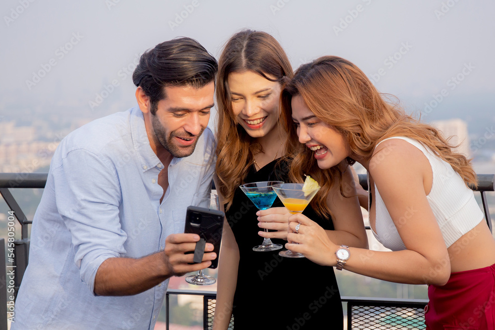 Group friends holding cocktail and selfie in party at restaurant luxury for celebrate with enjoyment together, society of man and woman meeting and taking a photo with fun, lifestyles concept. Group friends holding cocktail and selfie in party at restaurant luxury for celebrate with enjoyment together, society of man and woman meeting and taking a photo with fun, lifestyles concept.