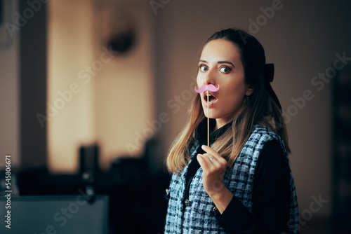 Female Business Manager Wearing a Pink Party Mustache. Woman in Corporate Job Fighting for Equal Opportunities as men 