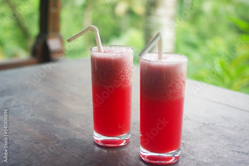 Wallpaper Mural Two glass cups of fresh watermelon juice on a wooden table at a villa in the hills of Ceking, Ubud — Bali, Indonesia Torontodigital.ca
