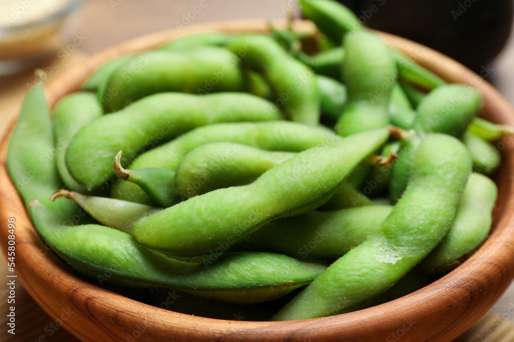 Bowl with green edamame beans in pods, closeup Bowl with green edamame beans in pods, closeup