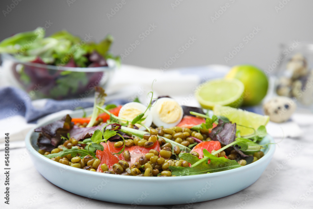 Plate of salad with mung beans on white marble table Plate of salad with mung beans on white marble table