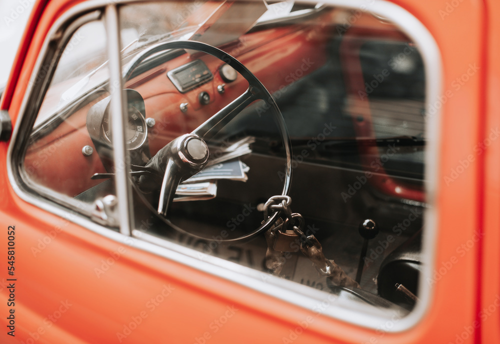 Naklejka premium retro car with a beautiful design, the steering wheel is closed with an old lock on a chain.