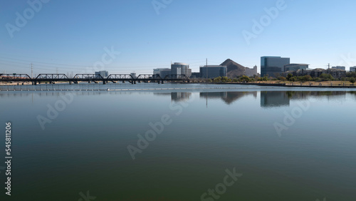 View of Tempe Arizona reflected on Tempe Lake on a calm clear day © Naya Na