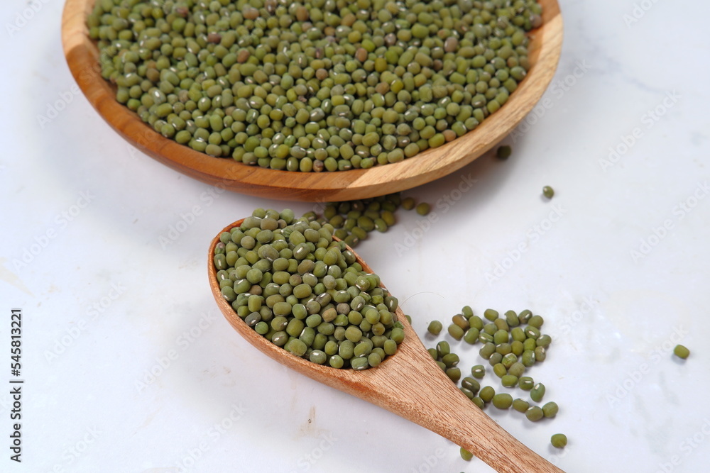 fresh mung beans in in wooden bowl isolated on white backgroun fresh mung beans in in wooden bowl isolated on white backgroun
