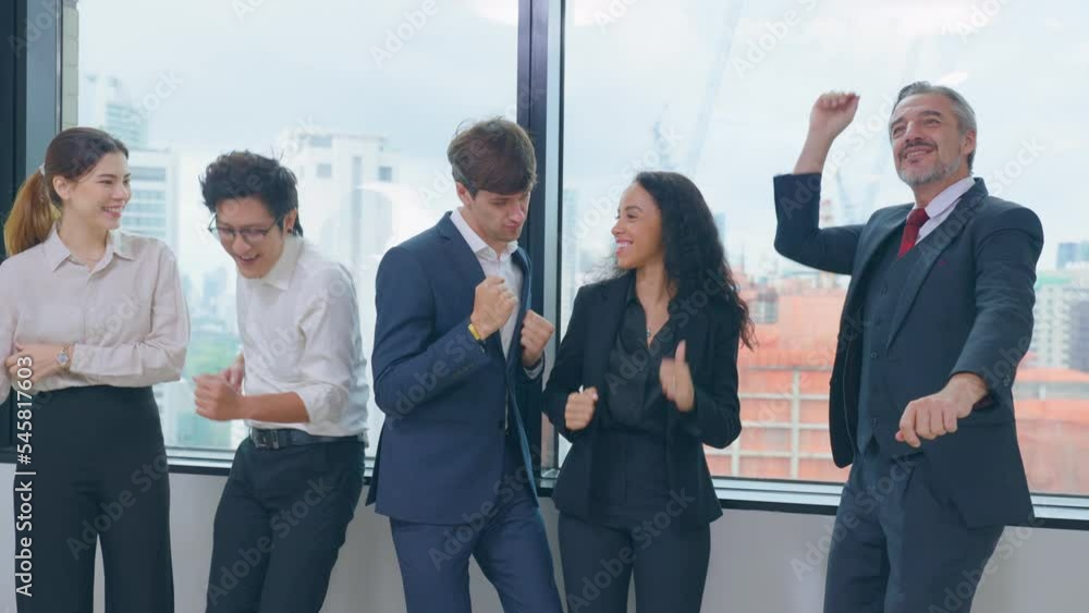 Group of businessman and woman dance with music while working in office Group of businessman and woman dance with music while working in office