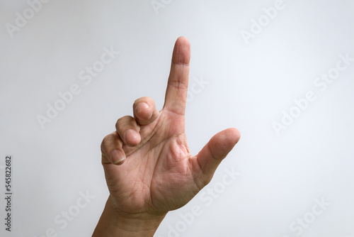 Foto Index finger pointing to something. Palm of hand facing front.