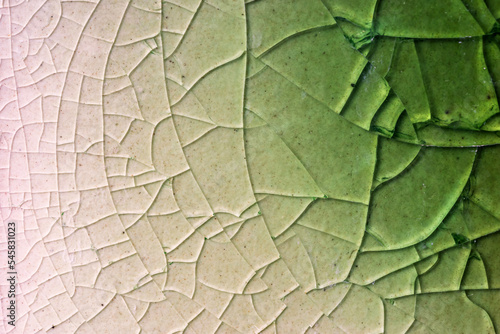 Fotografie Close up to background and texture of stretch marks cracked on emerald green glazed tile