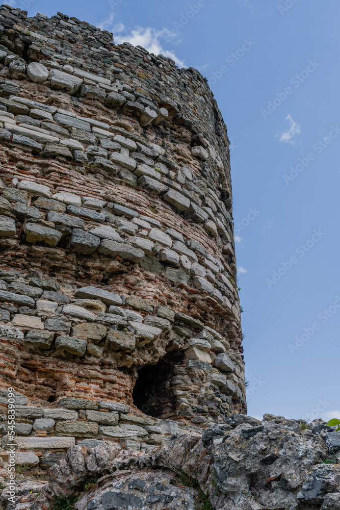Closeup of hole in side of ancient castle tower ruins.