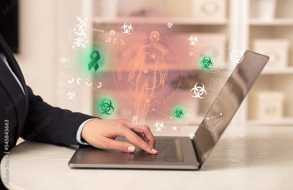 Doctor working on laptop with healthcare concept Doctor working on laptop with healthcare concept