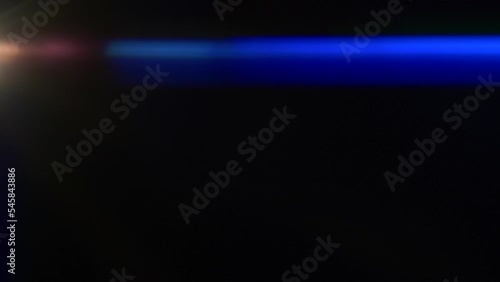 Anamorphic lens flare, bokeh light leaks, flash ray effect over black background photo