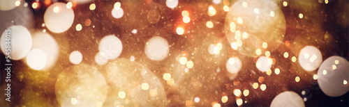 Foto Abstract light celebration background with defocused golden lights for Christmas