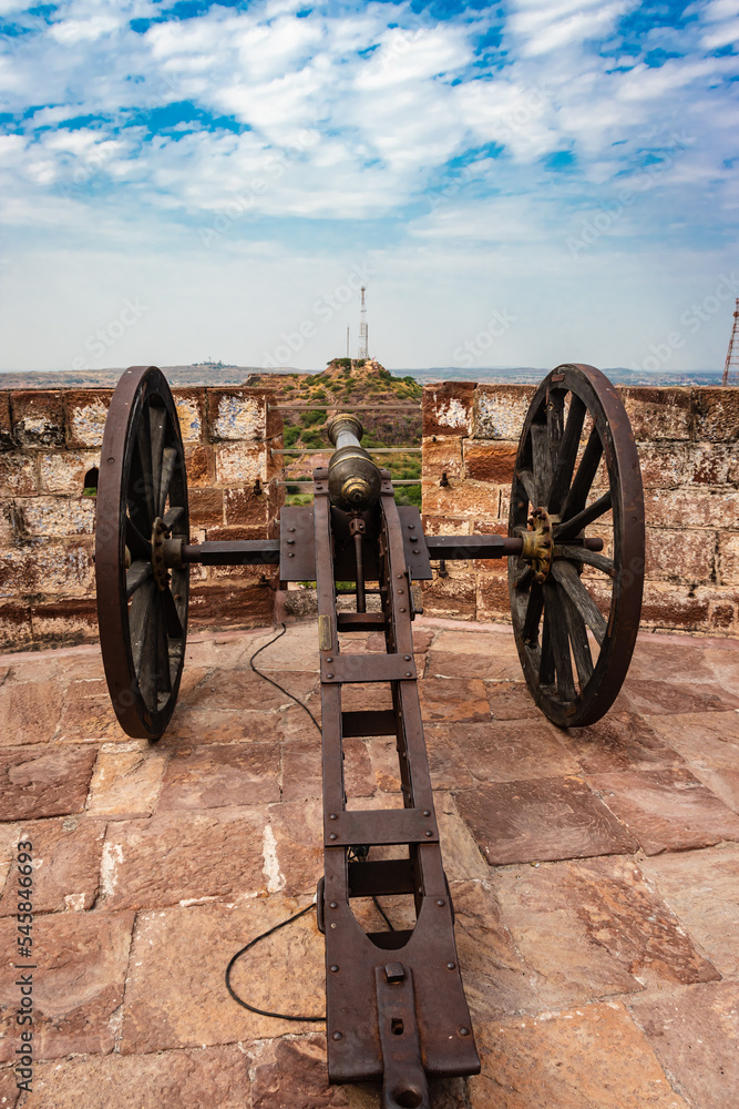 vintage cannon kept at top of the fort with bright sky from different angle