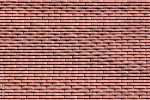 Background texture from image of red clay tiles on new roof