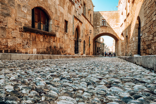 Cobblestone road in Street of the Knights called Ippoton in Old town of Rhodes city in Rhodes island, Greece