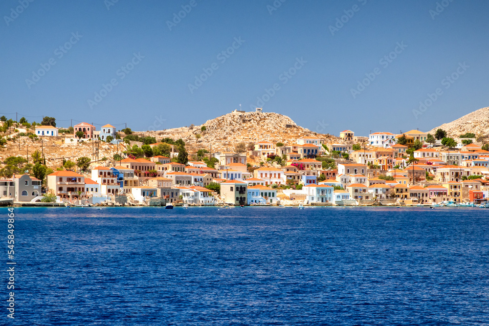 Colorful houses in picturesque small island Halki in Greece Colorful houses in picturesque small island Halki in Greece