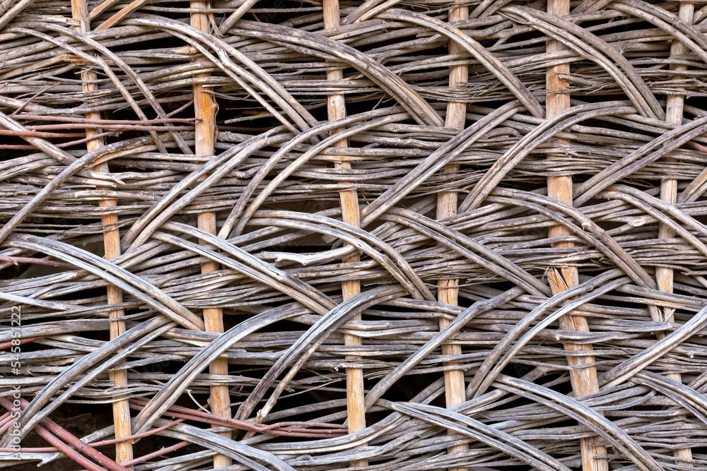 Textured background of old wicker vine. Close-up