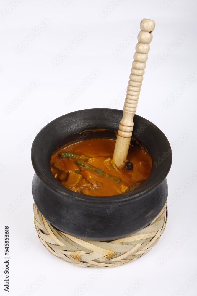 Kare-kare, a Filipino dish, served in a traditional pot Kare-kare, a Filipino dish, served in a traditional pot