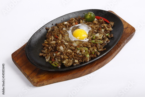 Pork sisig, a Filipino dish, served on a sizzling plate