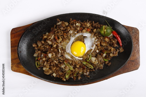 Valokuva Pork sisig, a Filipino dish, served on a sizzling plate