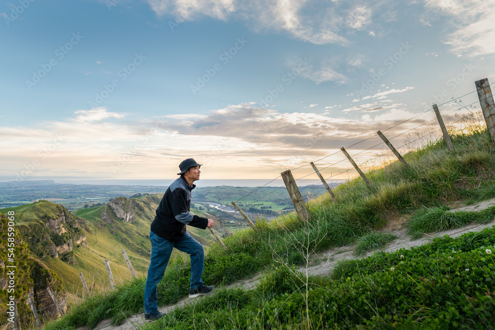 Hiking Te Mata Peak track. Climbing steep uphill, Hawke’s Bay.