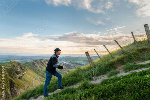 Obraz na płótnie Hiking Te Mata Peak track. Climbing steep uphill, Hawke’s Bay. w salonie