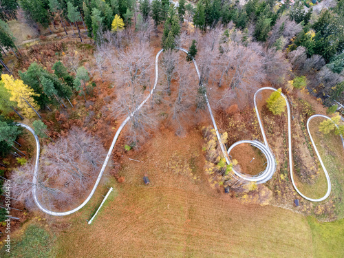 Obraz na płótnie Aerial view of summer bob track in beautiful nature with green mountains in Poland. w salonie
