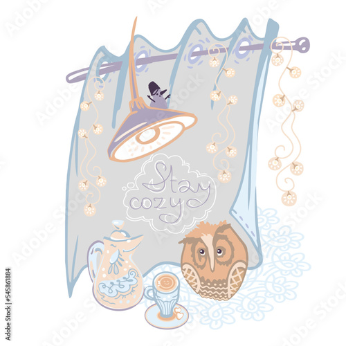 A picture of a cozy corner of a hygge-style home with a cup of hot drink and an owl.