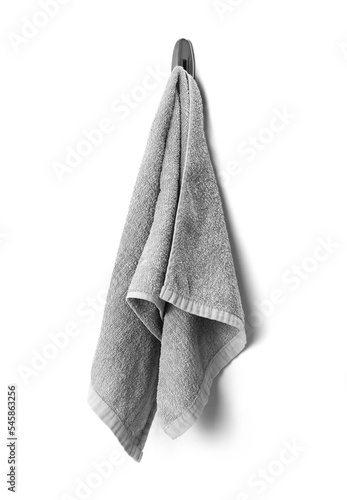 Grey towel hanging on a hook closeup isolated on a white background