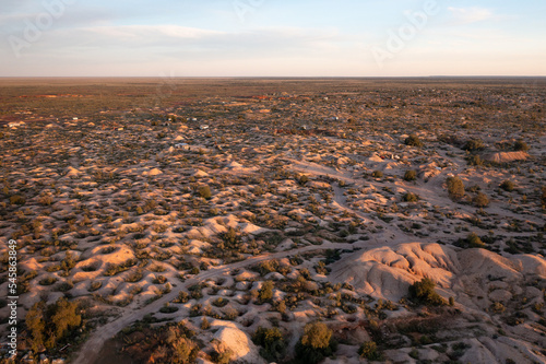 Aerial drone shot of abandoned mine shafts in desert landscape