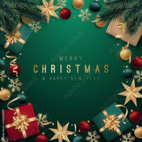 Christmas frame with free space framed by fir branches, gifts, balls and stars. Festive composition on green background. Top view.