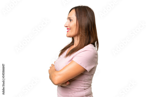 Middle-aged caucasian woman over isolated background in lateral position