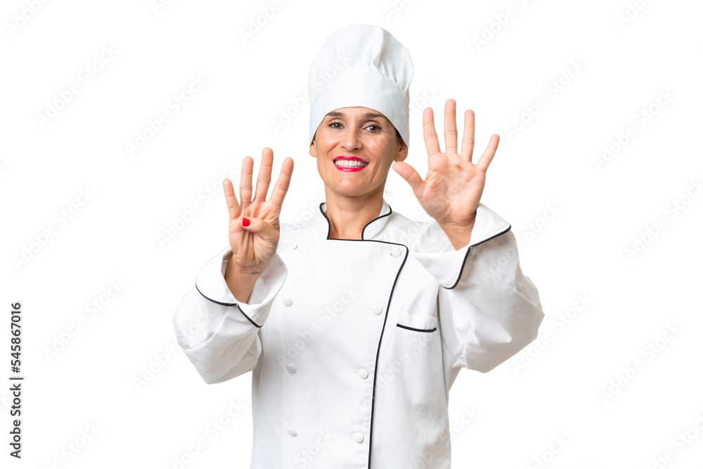 Middle-aged chef woman over isolated background counting nine with fingers Middle-aged chef woman over isolated background counting nine with fingers