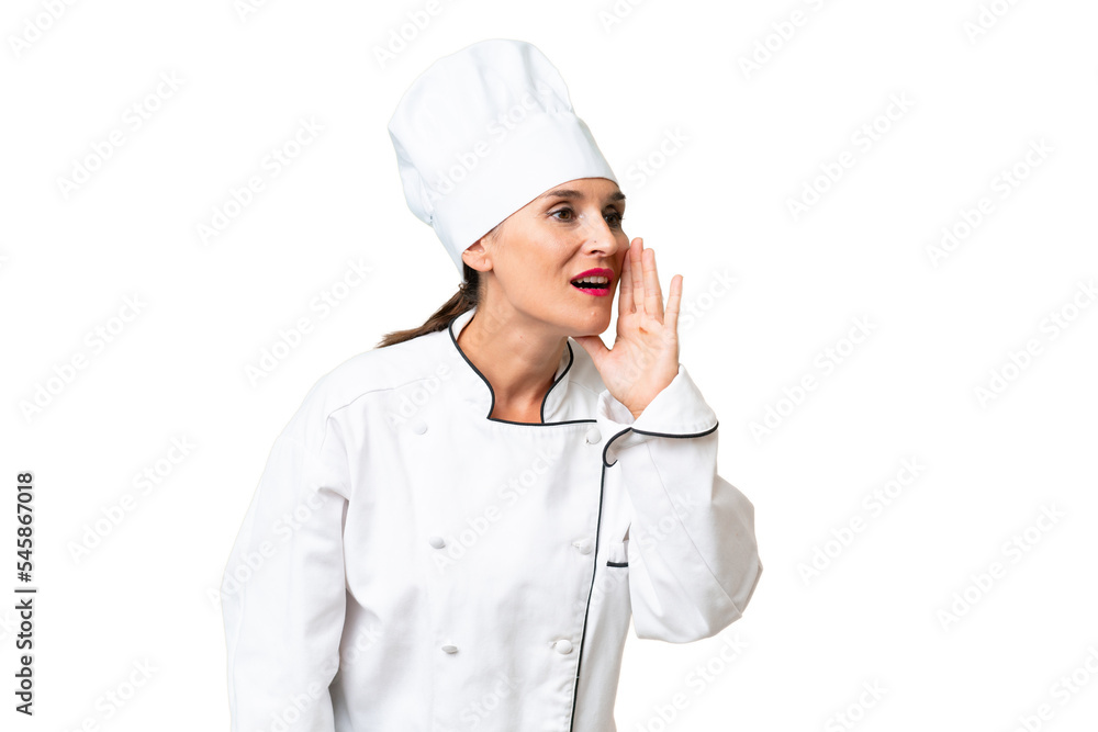 Middle-aged chef woman over isolated background shouting with mouth wide open to the lateral Middle-aged chef woman over isolated background shouting with mouth wide open to the lateral