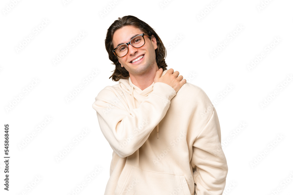 Young caucasian man isolated on green chroma background laughing