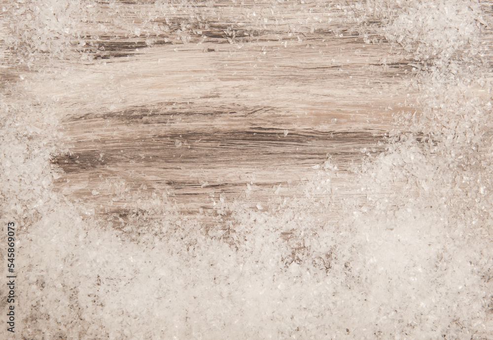 Naklejka premium Wooden gray background with artificial snow