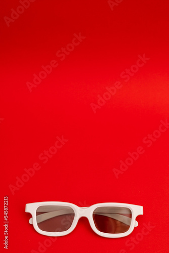 White-rimmed movie glasses on a bright background