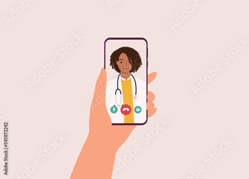 Patient’s Hand Holding Mobile Phone With Smiling Black Female Doctor On Video Call. Telemedicine. Telehealth. Close-Up. Flat Design Style, Character, Cartoon.