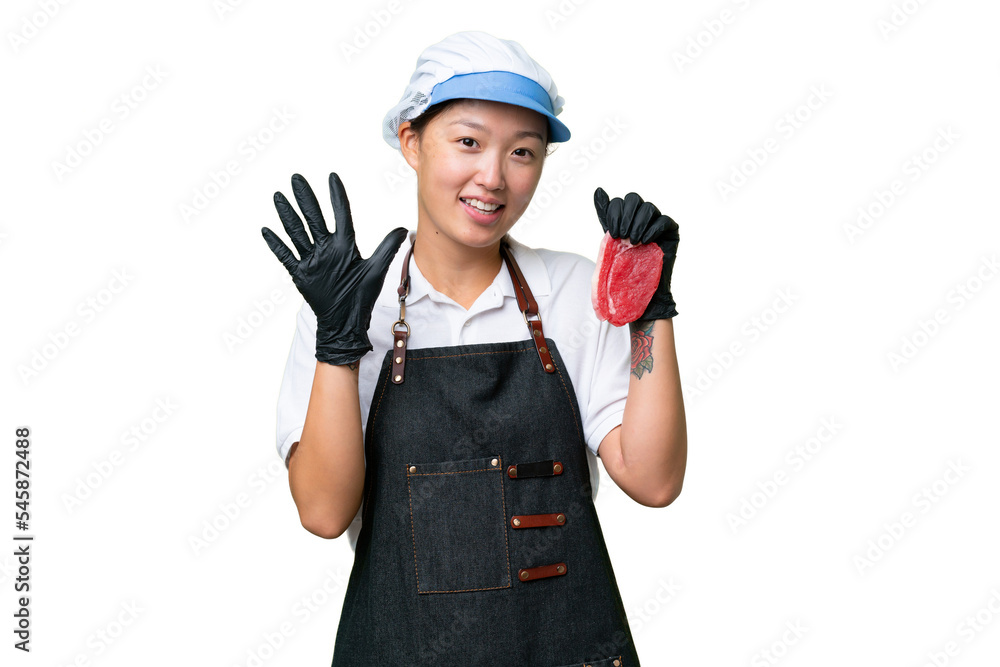 Young caucasian woman wearing an apron and serving fresh cut meat over isolated background counting five with fingers Young caucasian woman wearing an apron and serving fresh cut meat over isolated background counting five with fingers