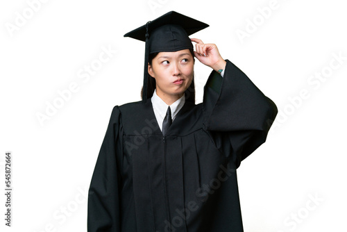 Young university graduate Asian woman over isolated background having doubts and with confuse face expression