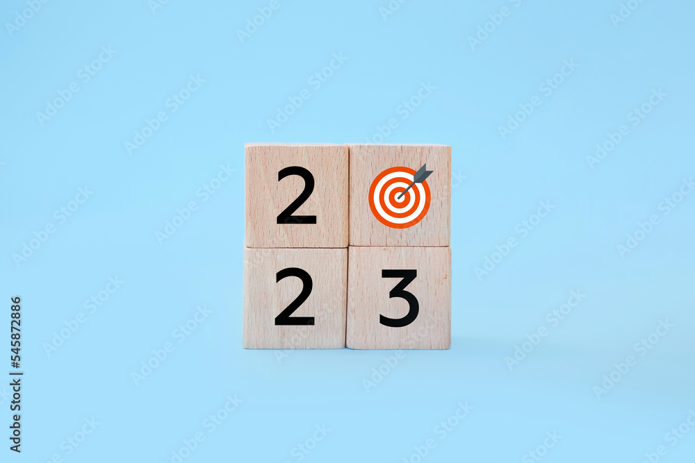 2023 with goal icon on table and blue background, copy space. Start new year 2023 with goal plan, goal concept, action plan, strategy, new year business vision 2023 with goal icon on table and blue background, copy space. Start new year 2023 with goal plan, goal concept, action plan, strategy, new year business vision