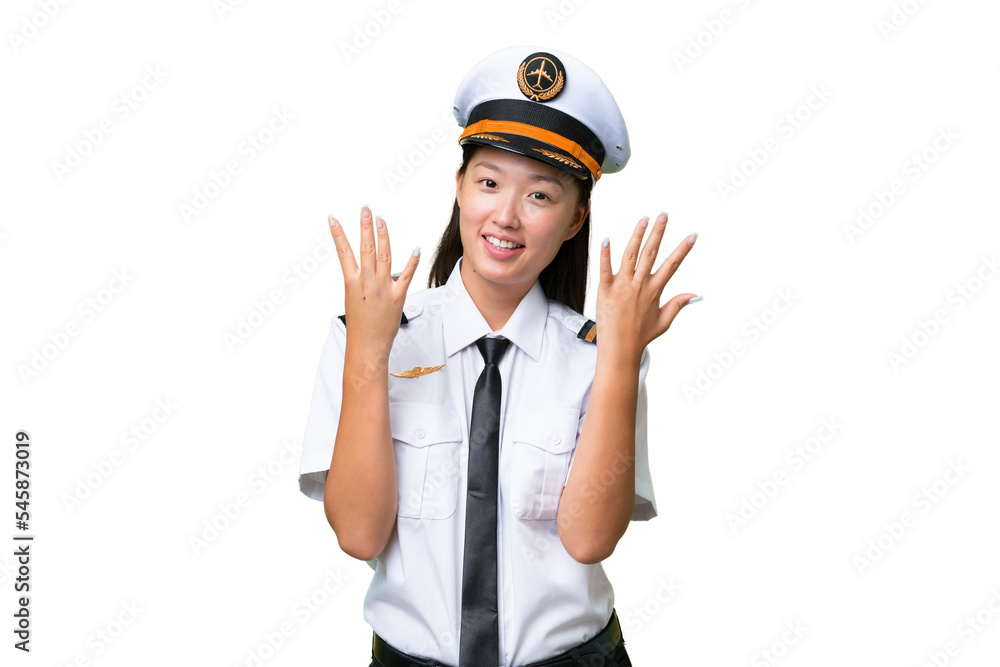 Airplane pilot Asian woman over isolated background counting nine with fingers Airplane pilot Asian woman over isolated background counting nine with fingers