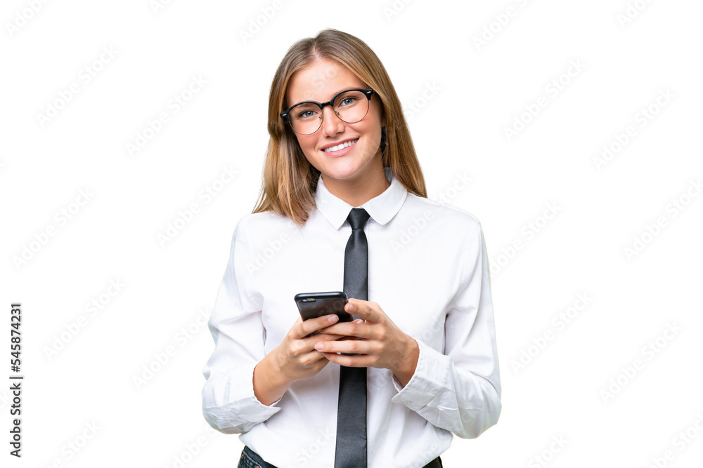 Young business caucasian woman over isolated background sending a message with the mobile Young business caucasian woman over isolated background sending a message with the mobile