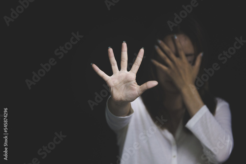 woman raising her hand Concept of stop violence against women, human trafficking, rape, sexual harassment of women, International Women's Day